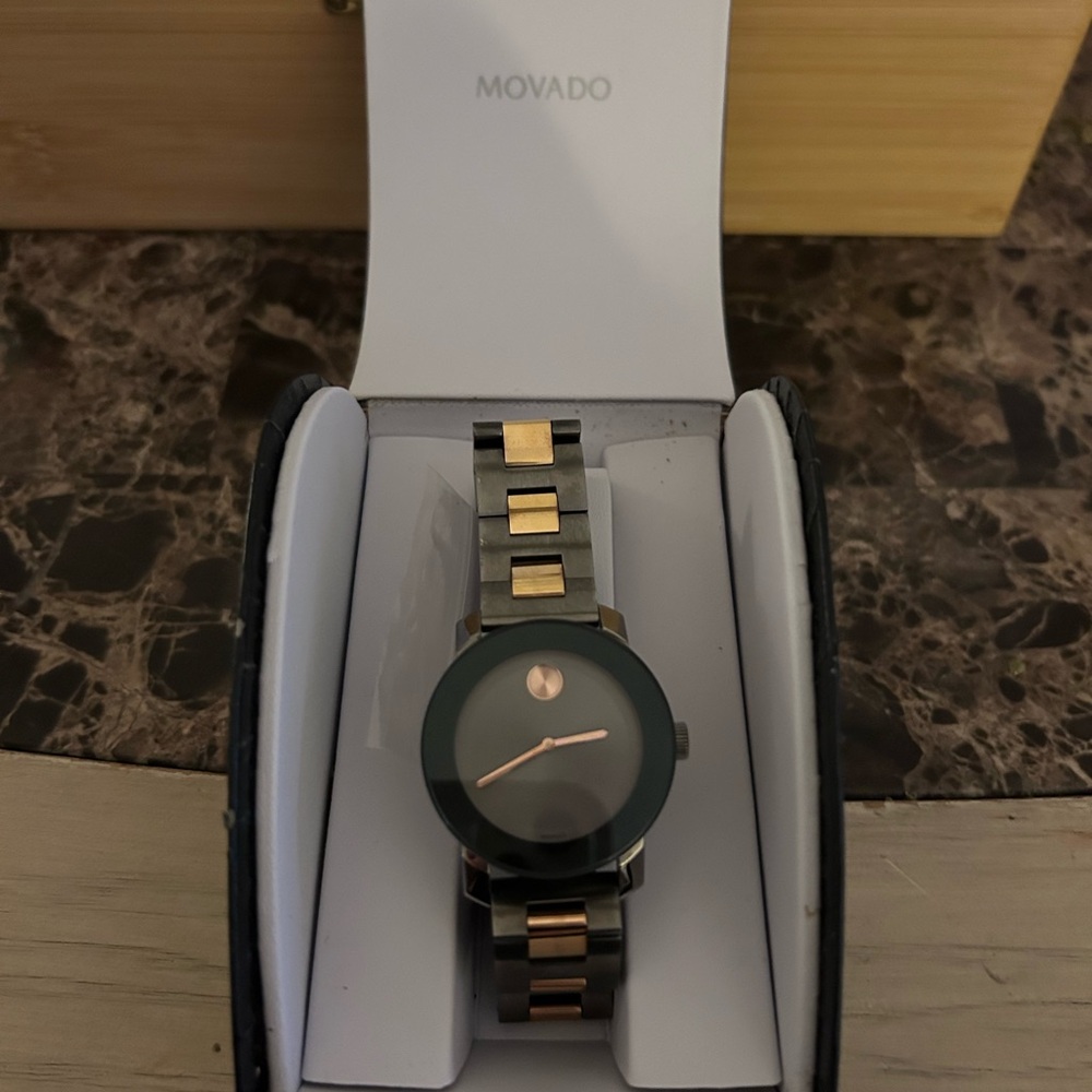Movado Black and Gold Watch worn twice, like new.
